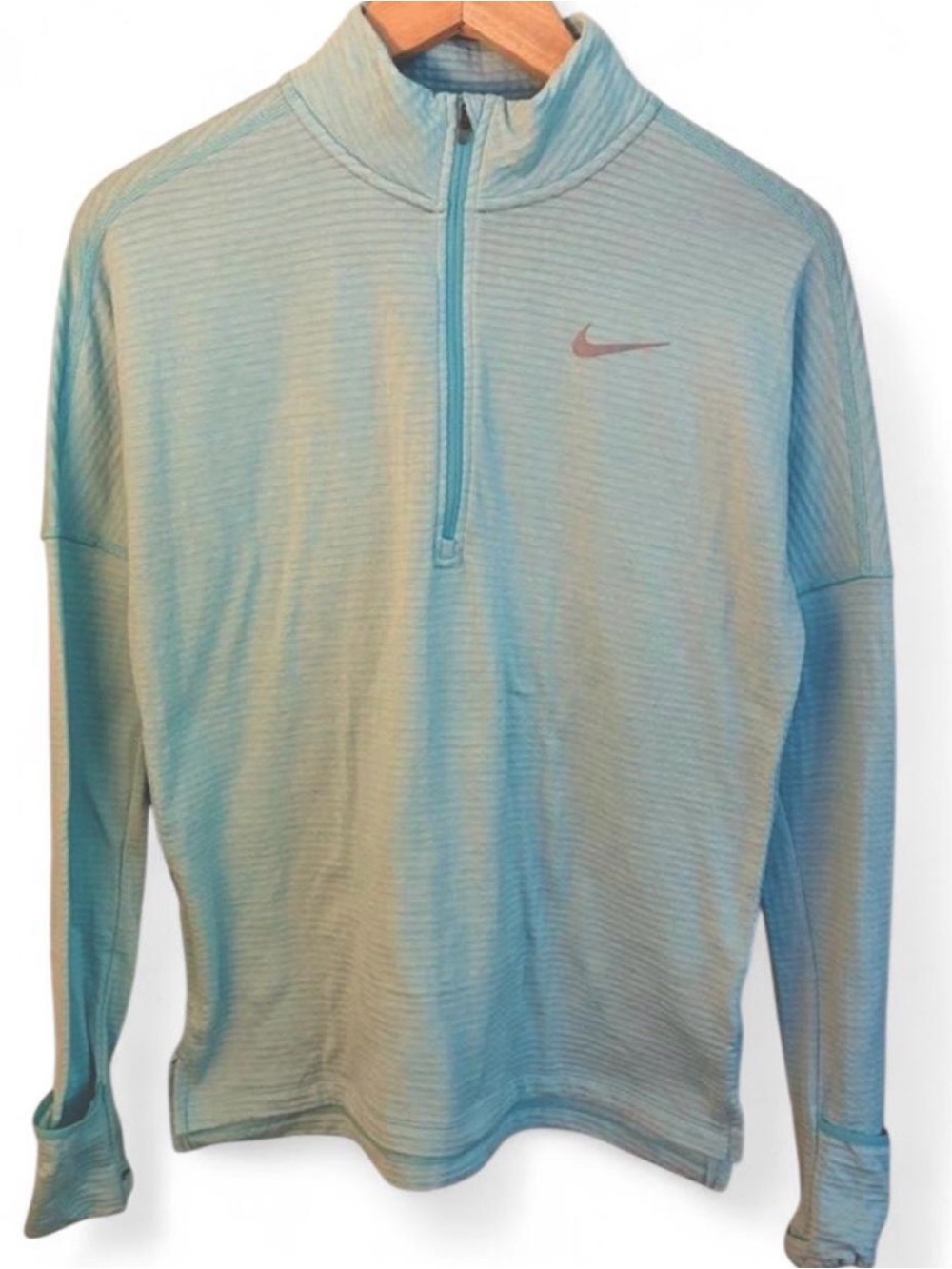 Nike Dri-Fit 1/4 zip light blue with subtle horizontal stripes running top